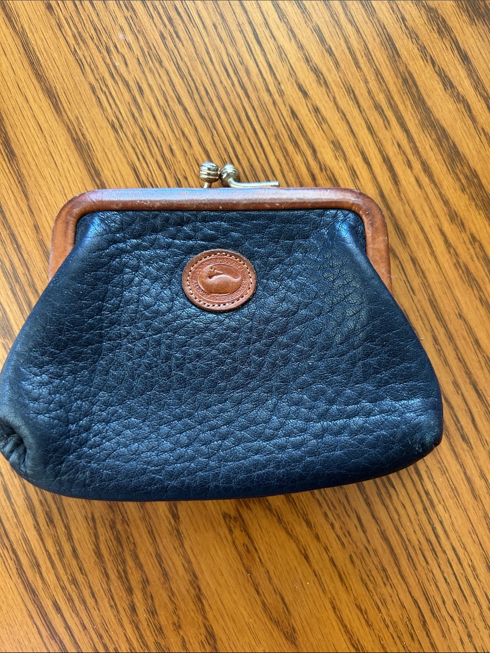 Dooney & Bourke Black Leather Coin Purse with Brown Trim and Logo